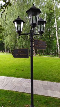 Signpost in the park with direction indicator