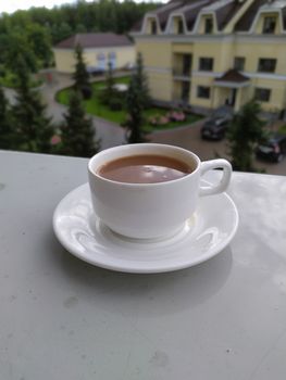 morning coffee on the windowsill of the balcony