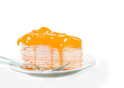 Closeup orange cake delicious on white background, selective focus