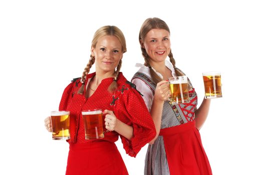 Pretty oktoberfest blonde women holding beer mugs in bar