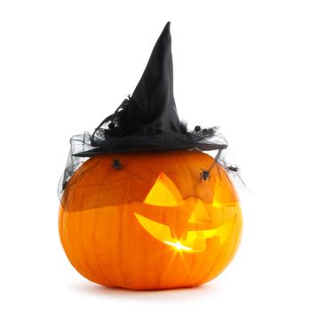 Jack O Lantern Halloween pumpkin with witches hat and spiders isolated on white background