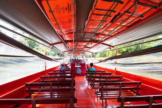 Bangkok, Thailand - April 21 2018: Boat travel in the canals of Bangkok on a hot sunny day