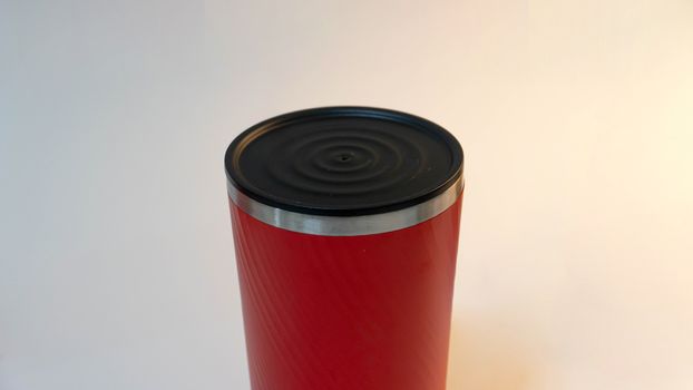 Red tumbler on white background