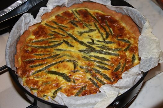 Asparagus tart pastry. Healthy pie filled with fresh asparagus.