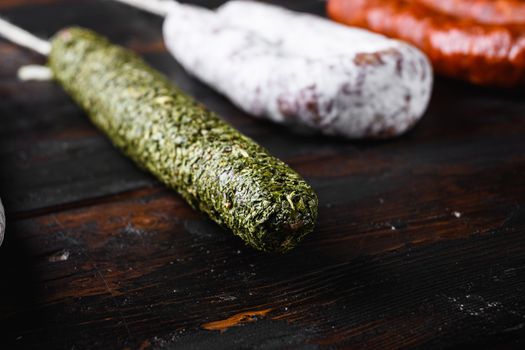 Spanish dry sausages on wooden background.