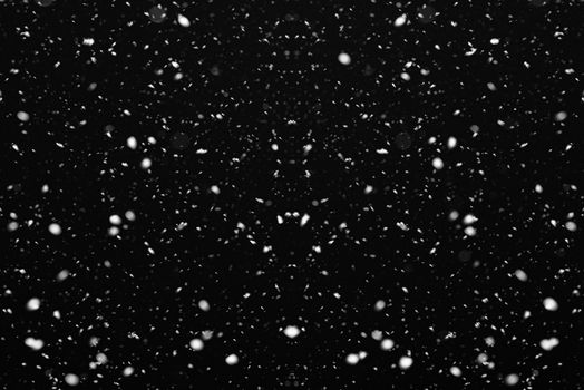 Snow on black background. Falling snow