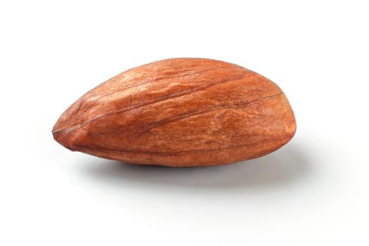 Single almond nut isolated on white background.