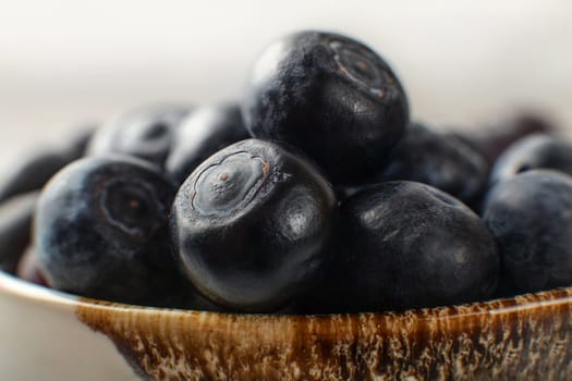 Close up photo of blueberries in small bowl.