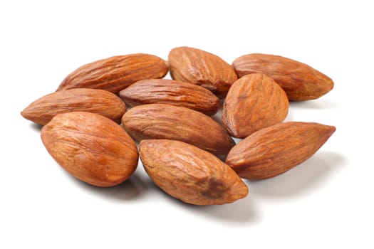 Pile of almond nuts isolated on white background.