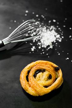 Raisin Bread on a black background, Cinnamon Roll, Butter and Raisin, Homemade Fresh Bakery Idea, Image from the top view