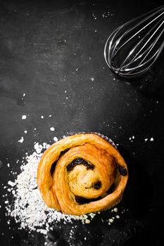 Raisin Bread on a black background, Cinnamon Roll, Butter and Raisin, Homemade Fresh Bakery Idea, Image from the top view