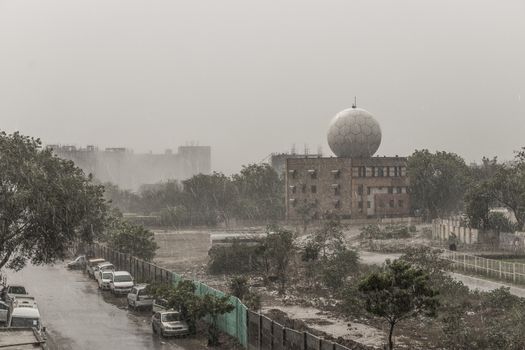 Monsoon rain in New Delhi India. Weather station at the Delhi airport.