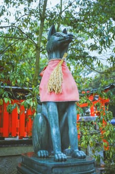 Fox statue in Fushimi Inari Taisha shrine, Kyoto, Japan.