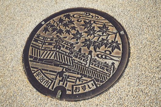 Uji, Japan - December 16, 2019 : Beautiful Manhole cover in Uji city, Kyoto, Japan.