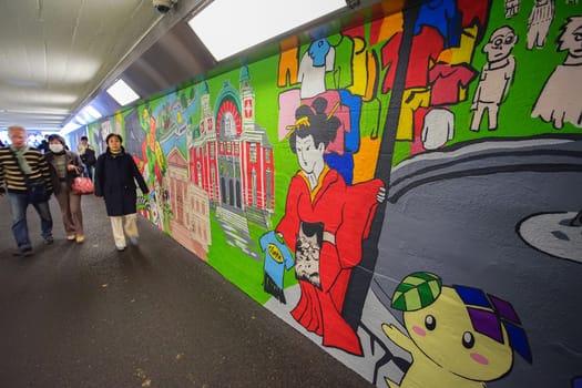 Osaka, Japan - December 16, 2019 : Beautiful sidewalk art through to Umeda Sky Tower, Osaka, Japan.