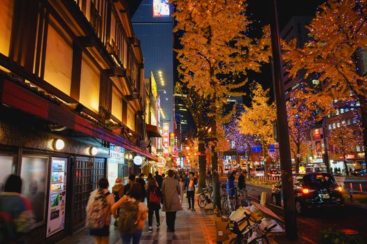 Osaka, Japan - December 16, 2019 : Night scene with beautiful yellow leaves of Ginkgo in Namba district, Osaka city, Japan.