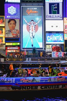 Osaka, Japan - December 16, 2019 : The famous Glico running man billboard in Namba-Shinsaibashi-Dotonbori shopping street, Osaka, Japan.