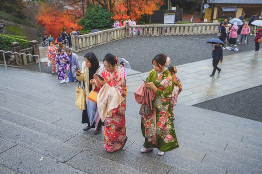 Kyoto, Japan - December 17, 2019 : Asian women with Kimono dressing in Kiyomizu-dera Temple, Kyoto, Japan.
