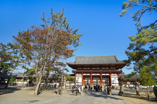 Nara, Japan - December 16, 2019 : Beautiful scene of the second Wooden gate Of Todaiji Temple, this is the most famous travel destinations of Nara city in Kansai area of Japan and this place has a lot of deers in the park.