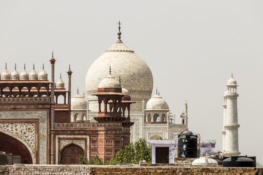 Taj Mahal in Agra, India. Mogul marble mausoleum with minarets, mosque and famous 17th century symmetrical gardens