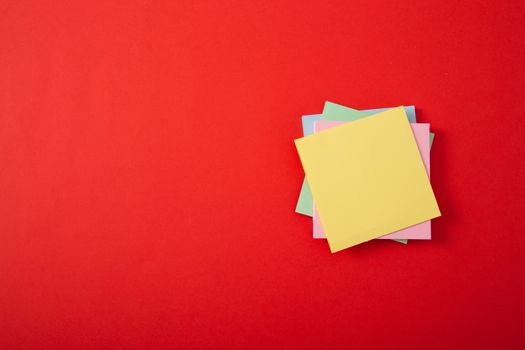 color sticky note pad on red background