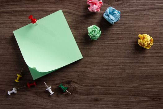 color blank notepad on wooden background