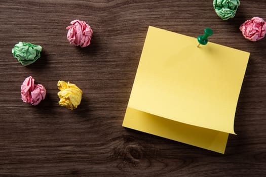 color blank notepad on wooden background