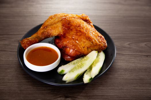 roasted chicken and vegetables on wooden table