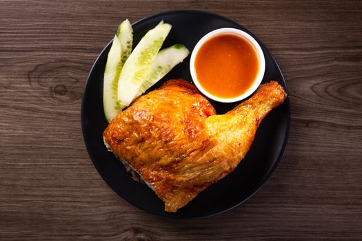 roasted chicken and vegetables on wooden table
