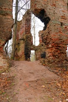 An old abandoned ruined red brick building. Wars and earthquakes