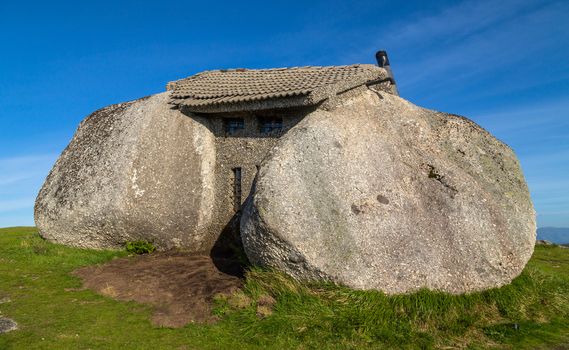 Casa do Penedo, a house built between huge rocks on top of a mountain in Fafe, Portugal. Commonly considered one of the strangest houses in the world.