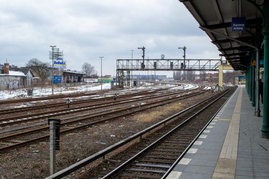 Berlin, Germany, February 2013: Railroad platform winter scene in Berlin, Germany, with empty tracks and platform