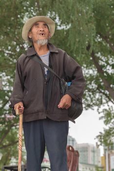Harbin, Heilongjiang, China - September 2018: Asian old man with a cane