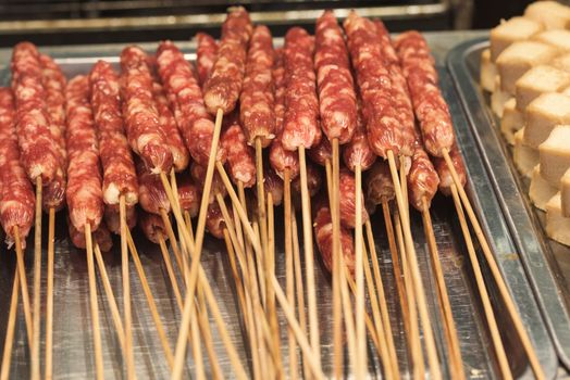 Street food asia. Meat on a stick. Chinese street food