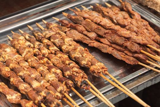 Street food asia. Meat on a stick. Chinese street food