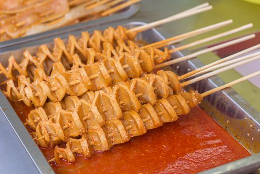 Street food asia. Meat on a stick. Chinese street food