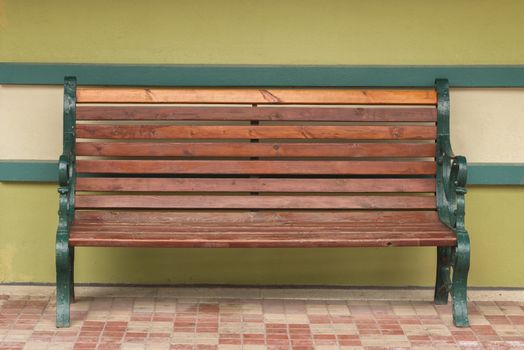 Bench against the wall. Old wooden bench