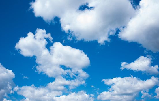 Blue sky with white clouds. Background with clouds