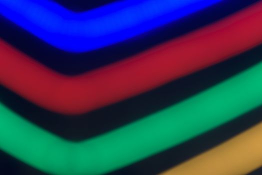 Colorful stripes on a black background. Abstract stripes
