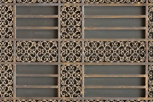 Decorative metal grille. Structure and ornaments of wrought iron