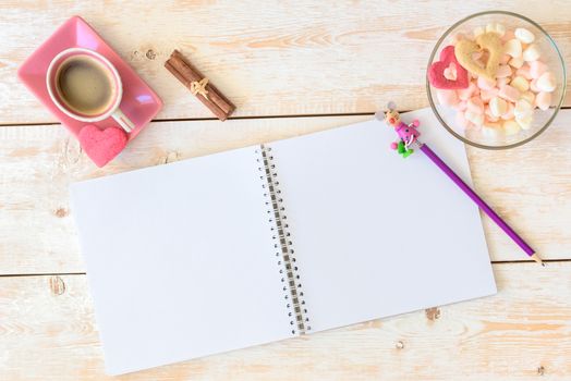 Blank paper on table. Blank sheet of paper, coffee cup, cookie, pencil on wood background. Sketchbook mockup