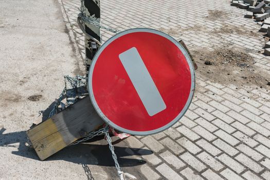 Traffic sign felled by vandals symbolizing traffic stop