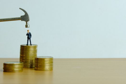 Miniature people concept - businessman stress thinking about financial crisis (toys photography )