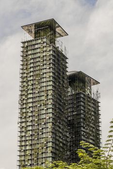 Le Nouvel KLCC, an ecological skyscraper with plants in downtown of Kuala Lumpur, Malaysia.