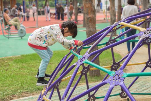 Harbin, Heilongjiang, China - September 2018: Little girl in the sports park