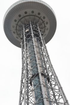 Iron high tower. Observation tower on a white background