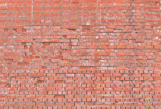 Old large red brick wall background. Rustic old brick wall texture