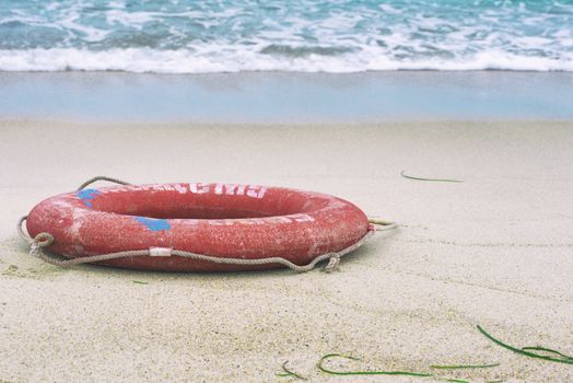 Lifebuoy on the beach. Concept of saving lives