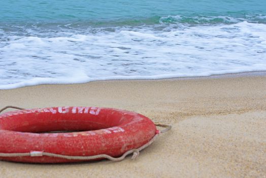 Lifebuoy on the beach. Concept of saving lives