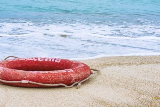 Lifebuoy on the beach. Concept of saving lives